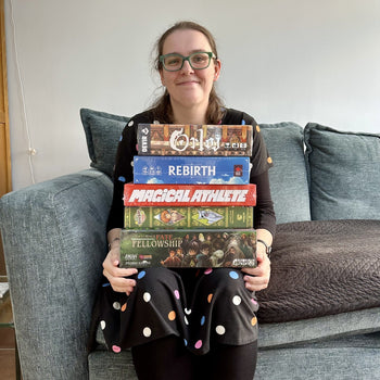 Amy with her bundle of board games
